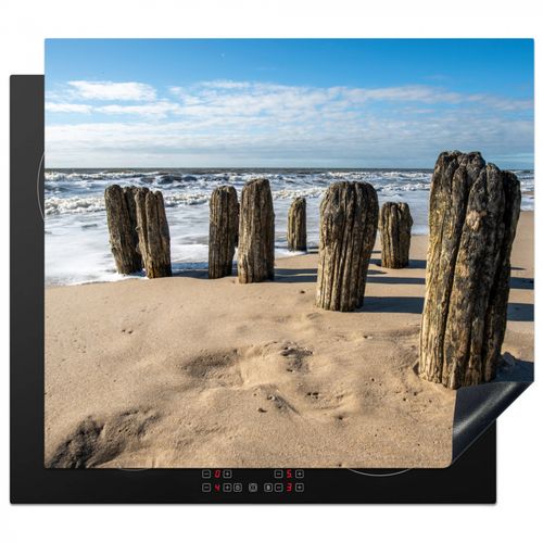 Verweerde Palen op het Strand